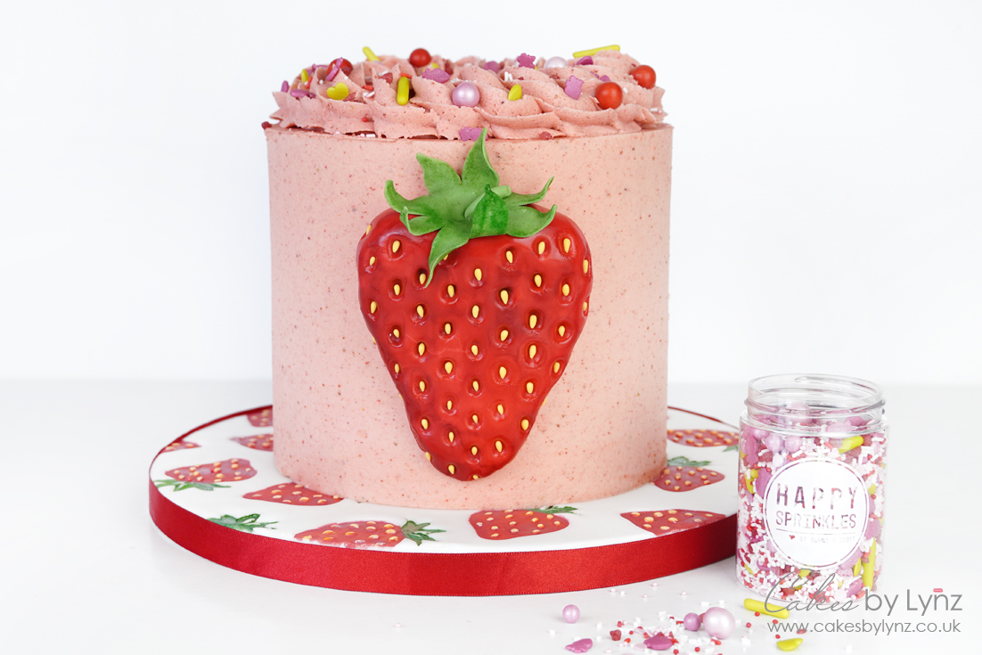 buttercream strawberry cake with sprinkles