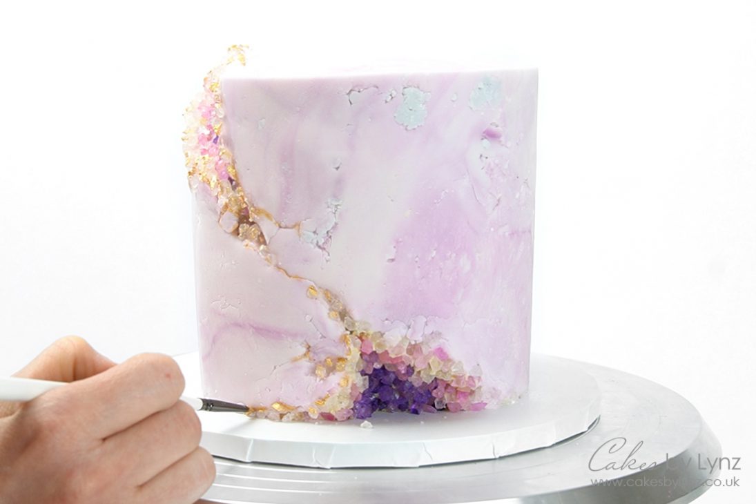 gold edible paint on a geode cake
