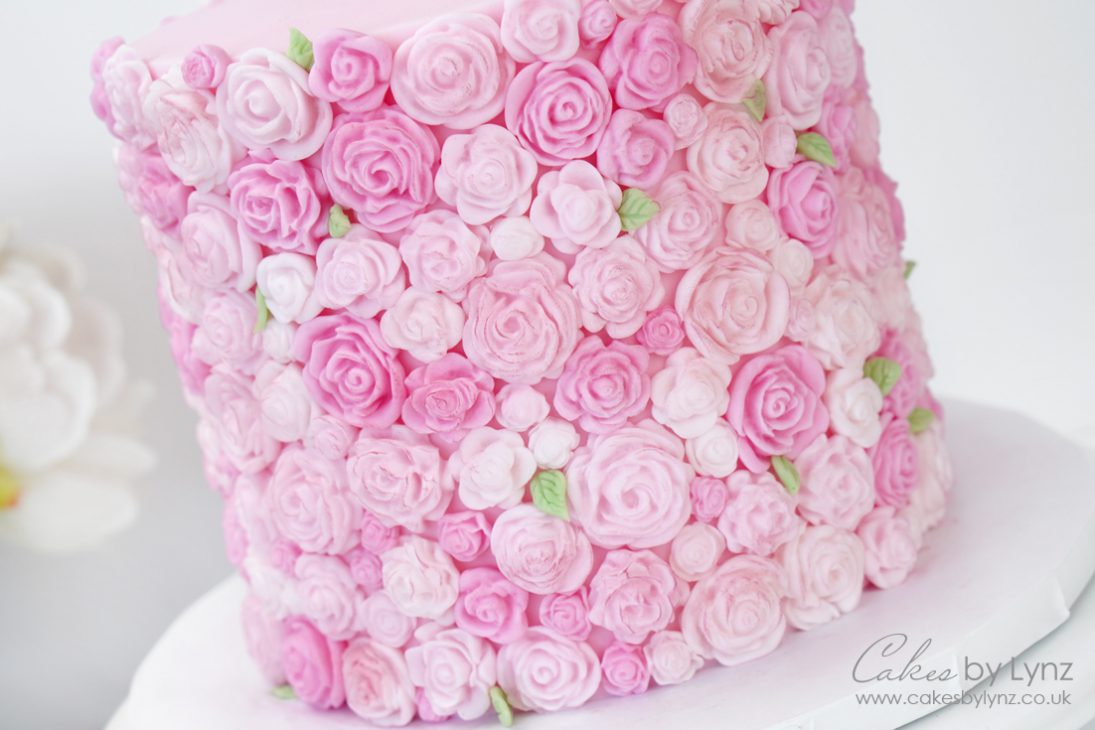Adding roses onto the side of your cake